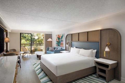 Stretch out in a bright studio with balcony and lounge seating.