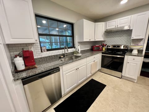 Kitchen- kuerig and coffee press, toaster oven, microwave, blender and more