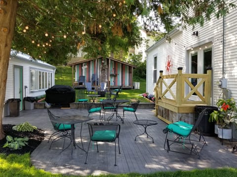 patio with grill and firepit in background
