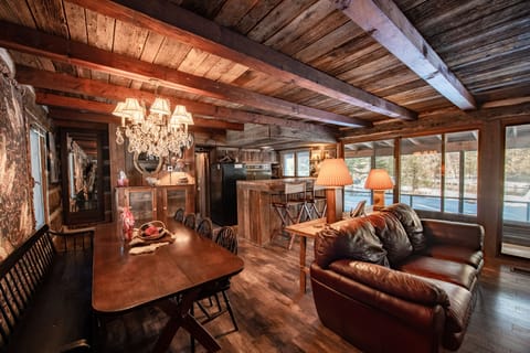 Surrounded by towering pines and over 1,800 feet of private Au Sable River frontage, Uncle Tom's Cabin is a rustic, authentic Northern Michigan retreat for anglers, nature lovers, and families.