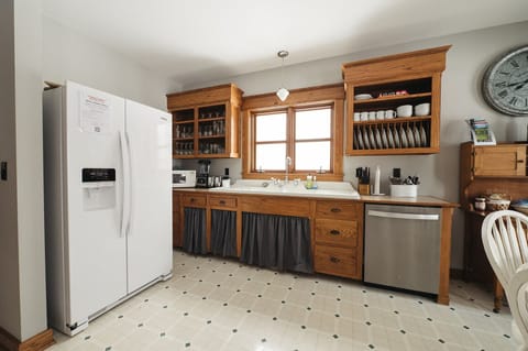 Perfect for home-cooked meals, you'll admire original details like vintage range and convenience of open shelves for easy meal prep.
