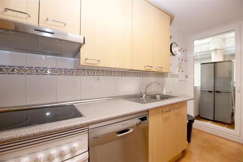 Kitchen from a different angle and laundry room to the rear