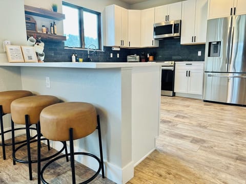 Barstools for additional seating in the spacious kitchen