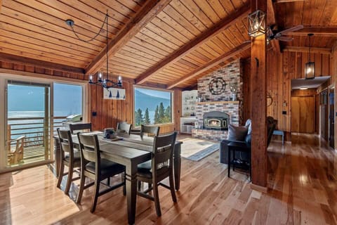 View from the kitchen to living area and beautiful ceiling to floor brick fireplace