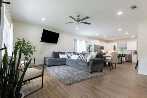 The living room with a 65” smart TV