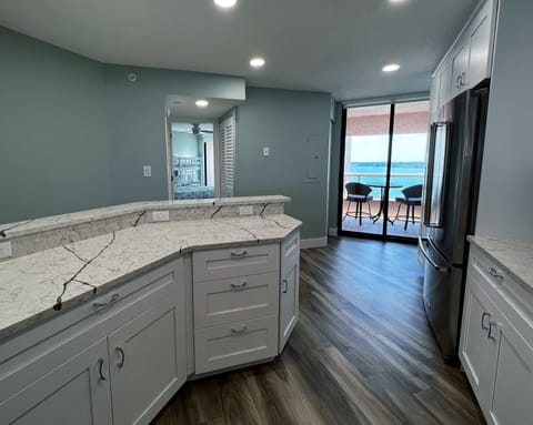Coffee on the kitchen balcony, anyone? Enjoy a view of the inter - Coffee on the kitchen balcony, anyone? Enjoy a view of the intercoastal water of Clearwater from the kitchen, guest bedroom, guest bathroom, and balcony off the kitchen.