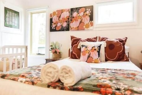 Main bedroom has a double bed + cot