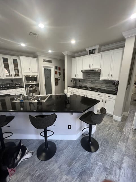 Kitchen to bar area and laundry room