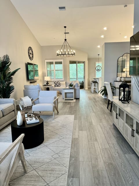 Open concept living space with high ceilings.