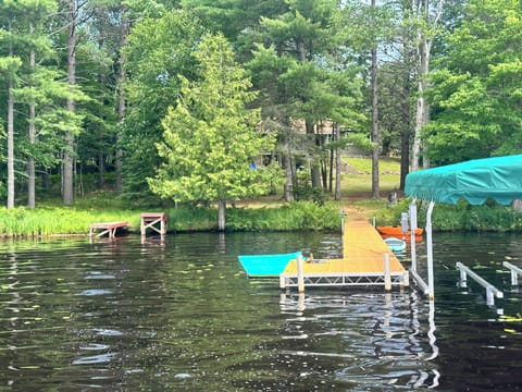 Water mat, paddle board and kayak for guest use. 
