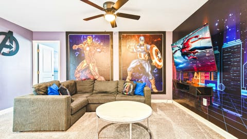 Unwind with your favorite heroes! Marvel-themed lounge with cozy seating and TV fun.