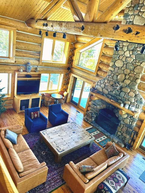 Spacious living room with wood burning fireplace