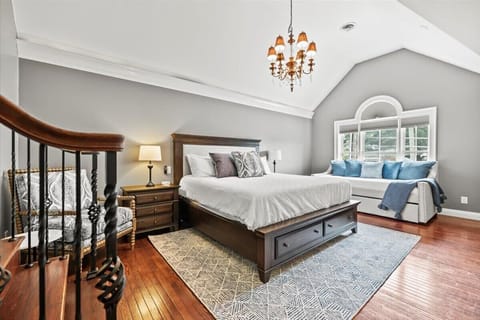 King bedroom with a sleeper sofa and trundle that pulls out for an extra twin bed.