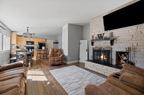 Living room with wood burning fireplace