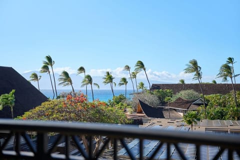 Sip morning coffee while palms sway over the shoreline.