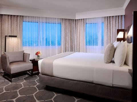 Wake up to bright corner windows and a cloud-soft bed.