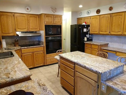 Large Kitchen with "eat around" table height counter