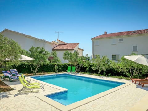 Water, Plant, Sky, Swimming Pool, Building, Azure, Window, Chair, Shade, Outdoor Furniture