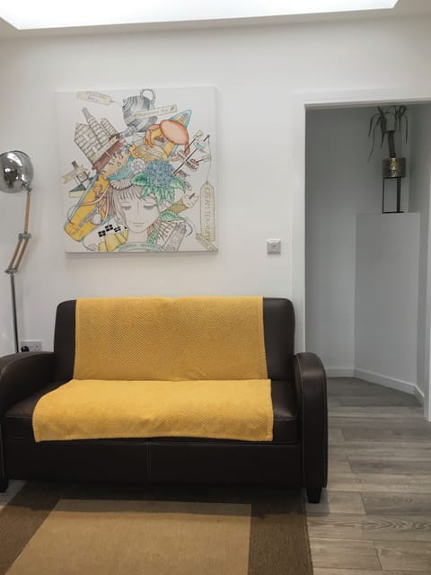 Lounge with Artwork, Sofa Bed & Door to En-Suite Bedroom