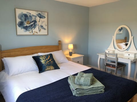 Kingsize double with wardrobe, chest of drawers and dressing table.