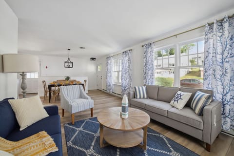 Second living room with natural lighting from the large windows