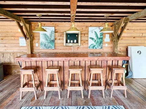 Outdoor patio offers a nice bar to hang day or  night