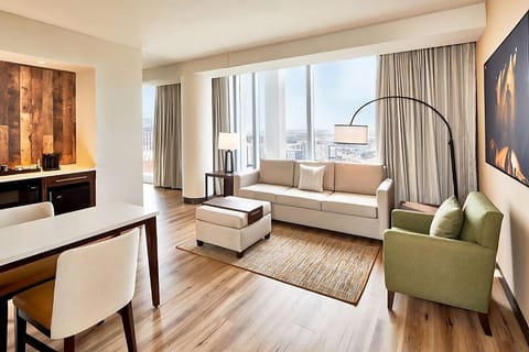 Stretch out in the airy lounge beside panoramic city windows.
