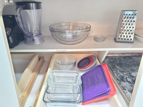 Tupperware, glass bowls, lots of pots and pans and plates and bowls for everyone