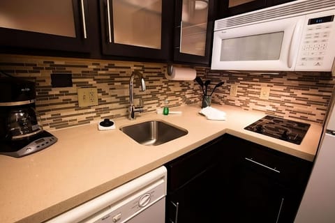 Enjoy a sleek kitchenette counter for quick breakfasts and snacks.