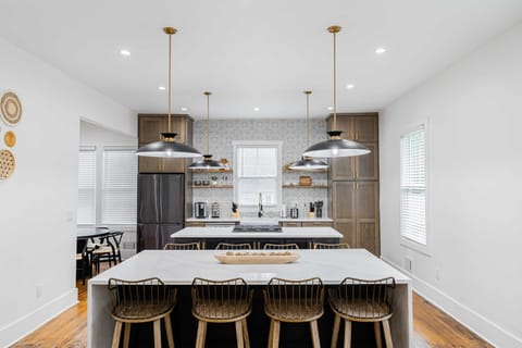 Fully stocked brand new luxury designer kitchen with two islands, and black stainless steel appliances. it'll be a joy to cook for the family in here!