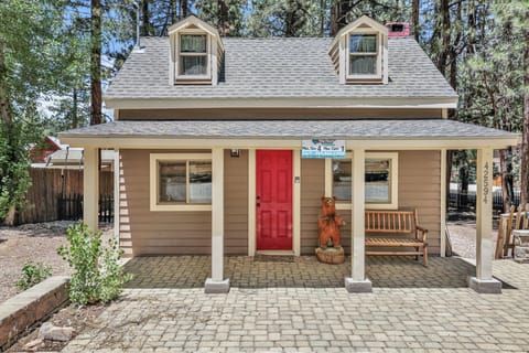 Welcoming cabin entry surrounded by towering pine trees, offering fresh mountain air and a peaceful forest setting—the perfect first impression for your Big Bear Lake getaway.