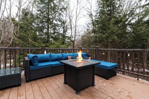 Expansive deck with fire pit table, outdoor seating, Weber grill, and hot tub!