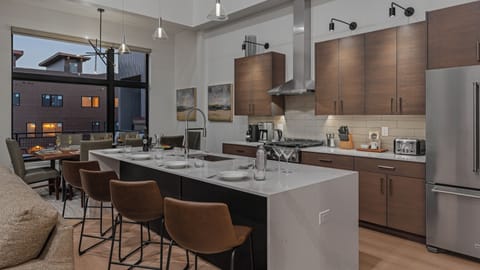 Kitchen, Main Level - Kitchen with breakfast bar seating