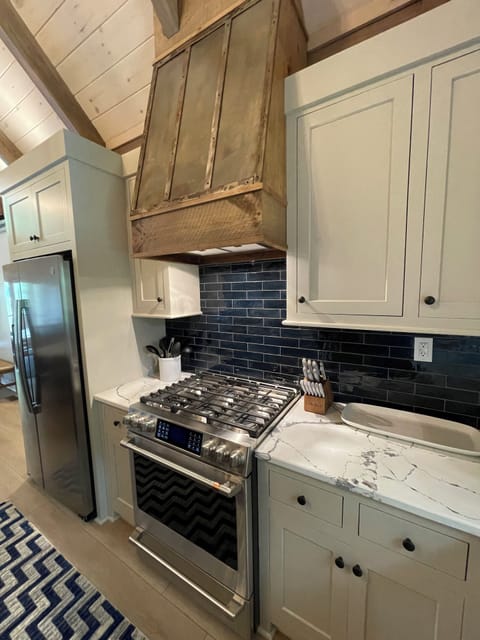 GE Profile gas range.  Custom kitchen.