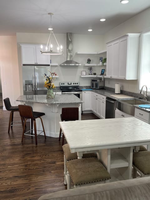Full kitchen with Pub Table and counter top seating.