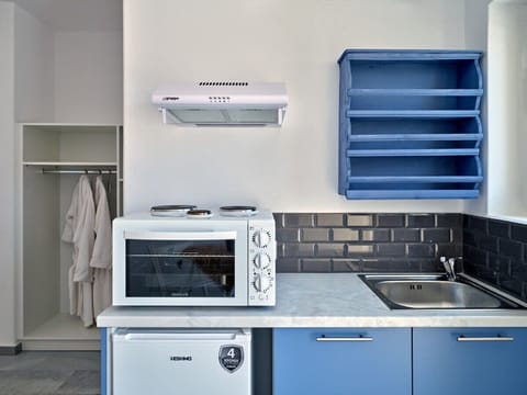 Explore the functional and compact kitchenette space