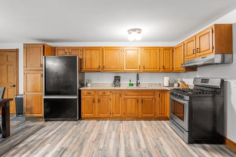 Cook up culinary delights in this spacious, well-equipped kitchen with sleek appliances!