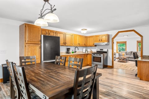 Dining Area: Gather around the stylish table and enjoy meals with family in a sunlit space!