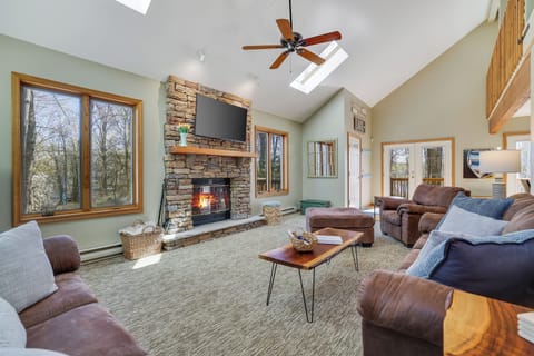 Den view of the front door and lake peaking through the windows