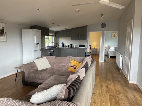 View from veranda door showing 2 bedrooms and door the bathroom on the right. 