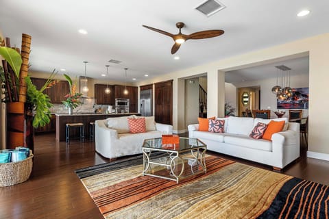 Bright living space with open sightlines to the kitchen and dining area.