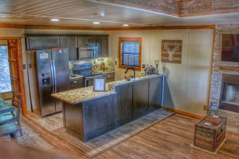 Fully equipped kitchen featuring granite complete with pots, pans & knife set!
