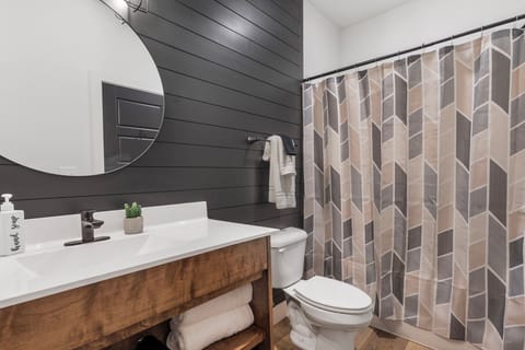 Upper level king bedroom bathroom with tub/shower