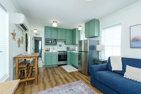 Full kitchen with many cooking essentials.