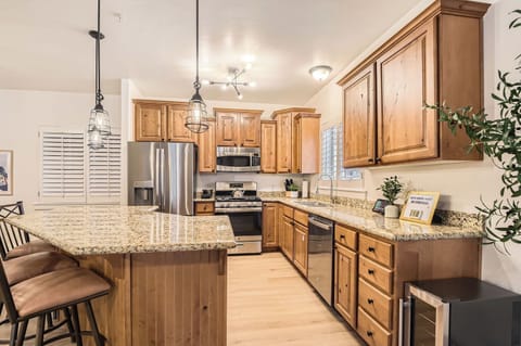 Cook like a pro in this gourmet kitchen featuring granite countertops, stainless steel appliances, and custom wood cabinetry
