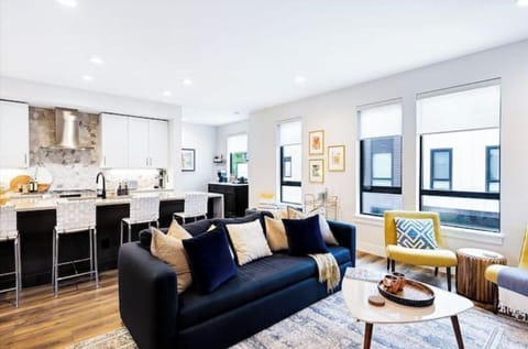 Living area with gas fireplace, remote-operated Hunter Douglas window shades