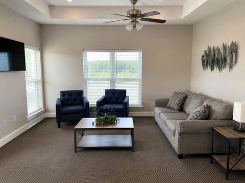 Bright, spacious living room with cozy seating and natural light