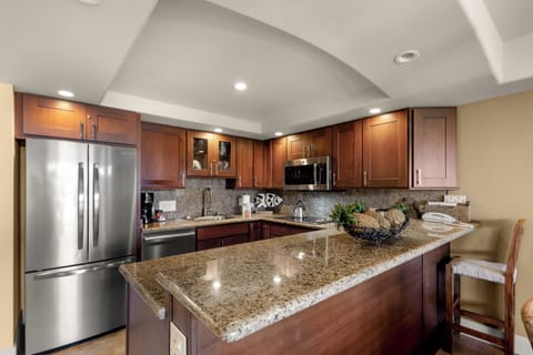 Your fully equipped gourmet kitchen features granite countertops and premium appliances, perfect for preparing memorable meals during your stay.