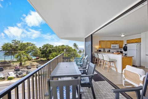 Enjoy morning coffee with stunning ocean views from your covered balcony, complete with dining space that flows into your fully-equipped kitchen—perfect for entertaining or relaxing.