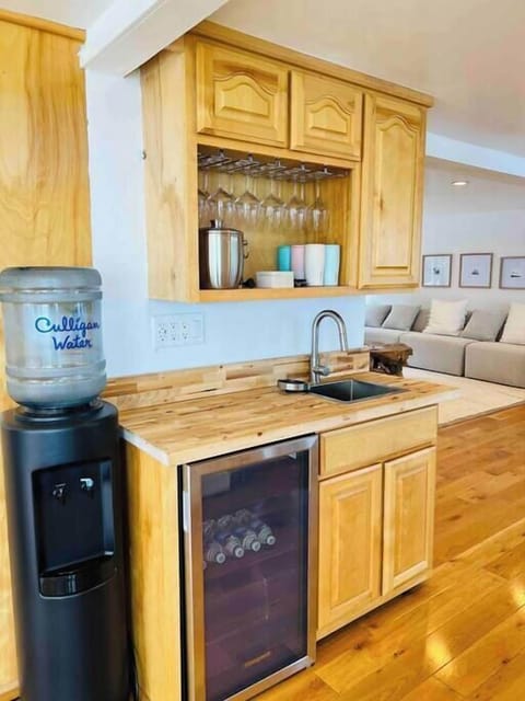 Enjoy a drink, cocktail, or glass of wine at our wet bar, adjacent to the Living Room and outdoor Dining area.